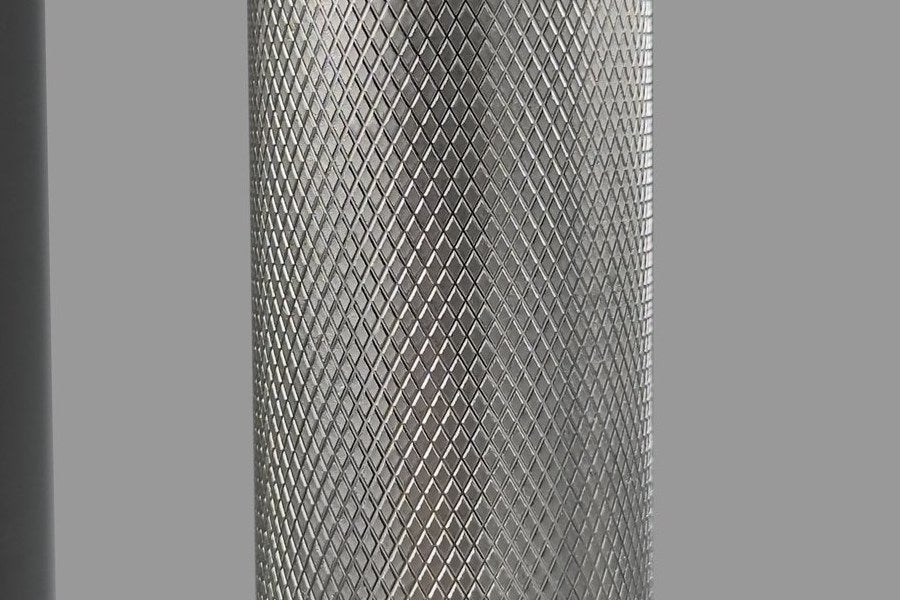 Macro of the knurled barbell handle on the Tuff Tumbler.